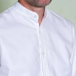 White Cotton ‘Admiralty’ Grandad Collar Shirt -Home And Daily Necessities Store yarmouth oilskins white cotton granddad shirt neck closeup 600x600 1